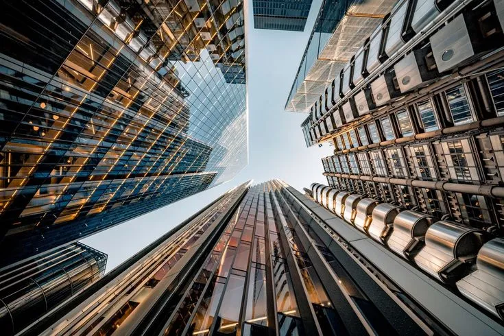 This may contain: looking up at tall buildings in the city