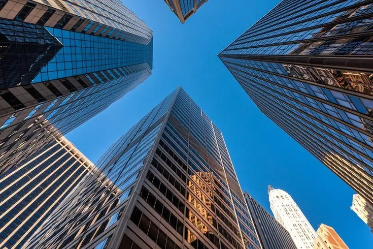 This may contain: looking up at skyscrapers in new york city