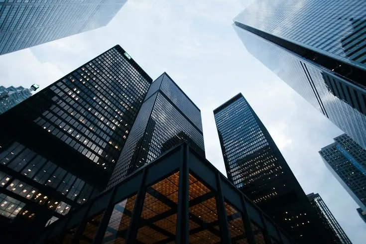 This may contain: looking up at tall buildings in the city