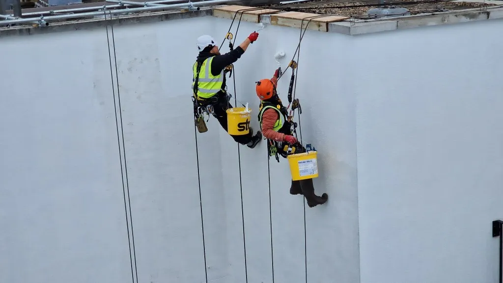 Exterior building painting using abseiling - Repair Abseiling Ltd.