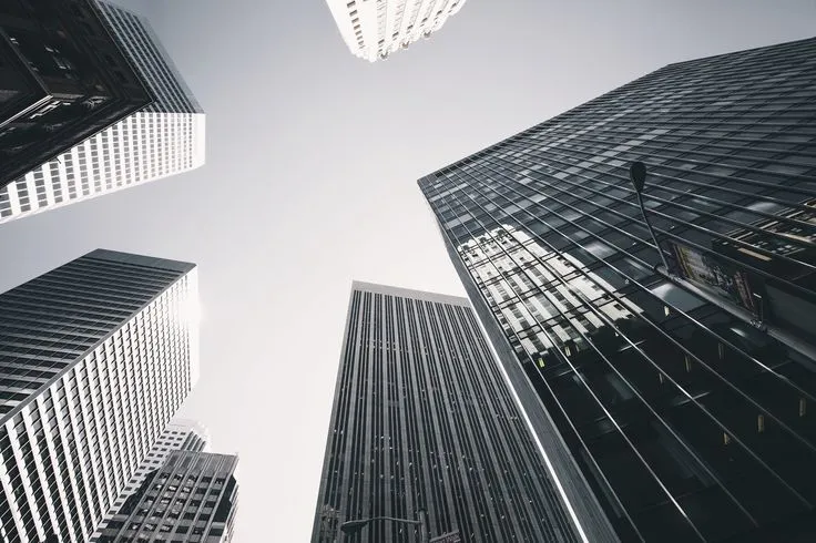 This may contain: looking up at tall skyscrapers in the city
