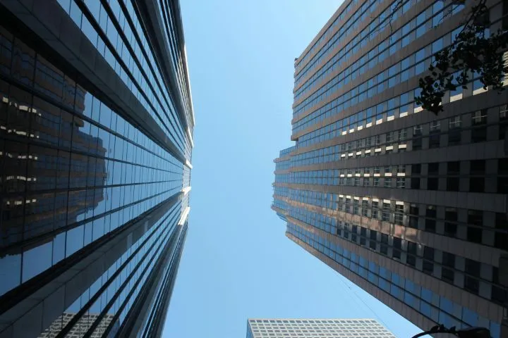 This may contain: looking up at tall buildings in the city
