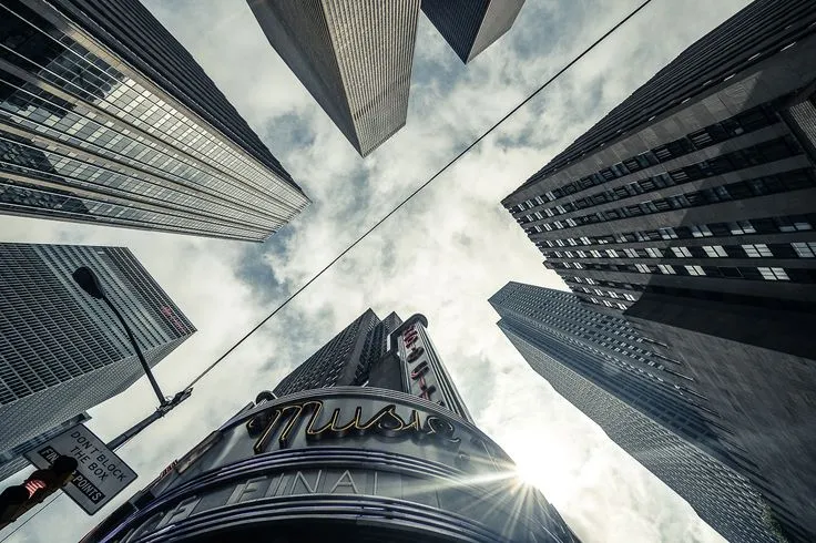 This may contain: looking up at tall buildings in the city