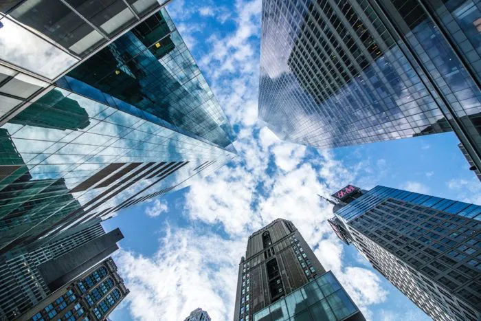 This may contain: looking up at tall buildings in the city