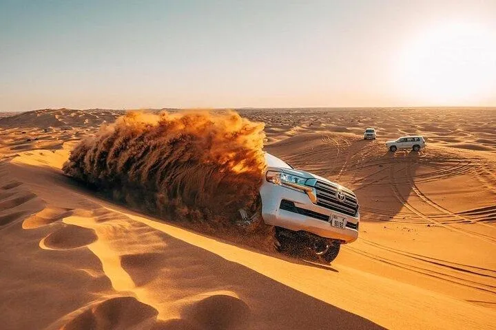Morning Red Dunes Safari: Camel Ride & Sandboarding Adventure in Dubai | Pelago