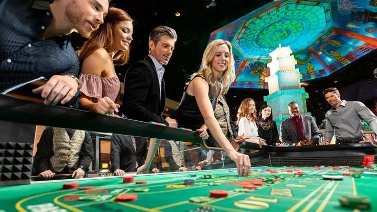 This may contain: people playing roulejack in a casino