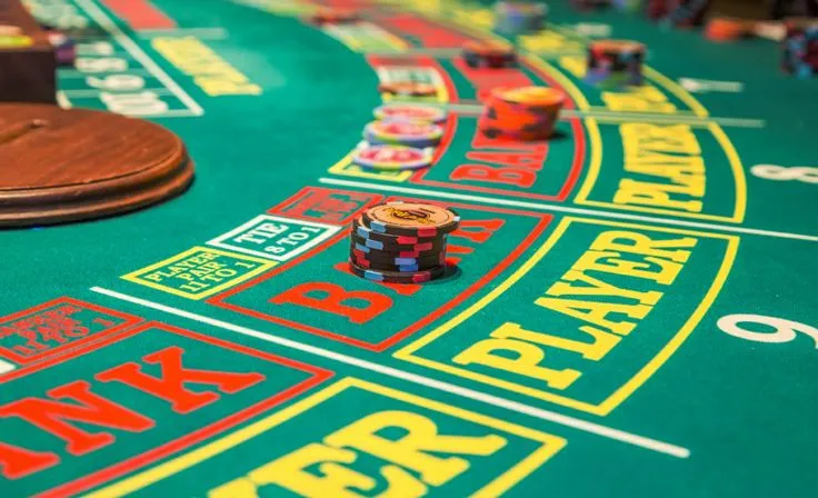 This may contain: a casino table with chips and cards on it
