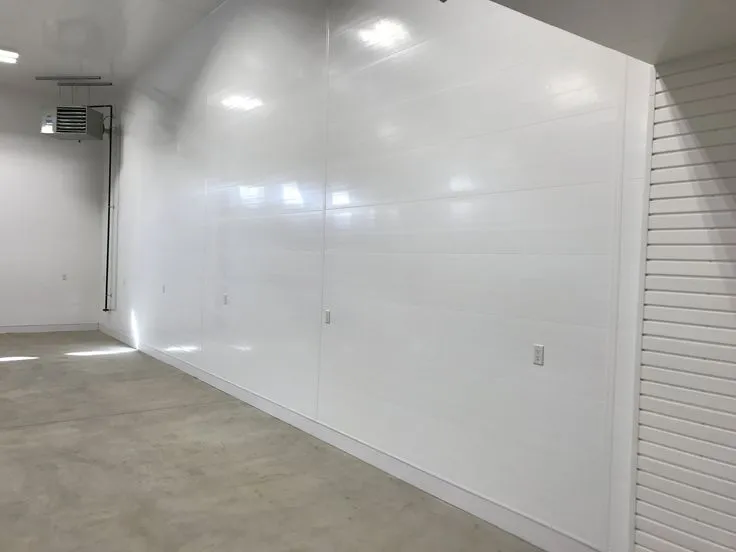 This may contain: an empty room with white walls and doors