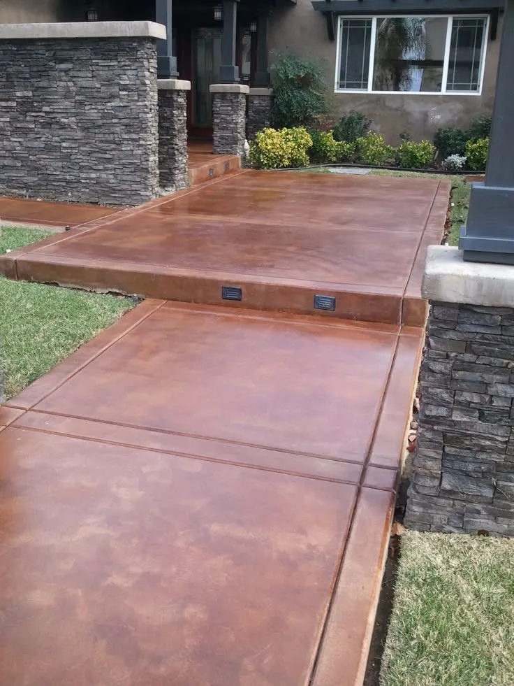 This may contain: an outdoor patio that has been cleaned and is in the process of being finished with concrete
