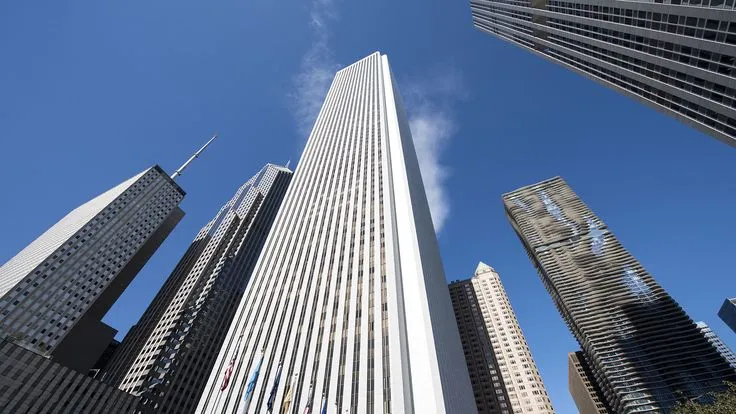 This may contain: looking up at skyscrapers in the city