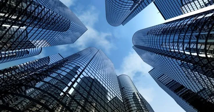 This may contain: looking up at skyscrapers from the ground
