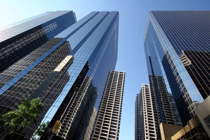 This may contain: the tall buildings are all very high in the sky, and there is no image here to provide a caption for