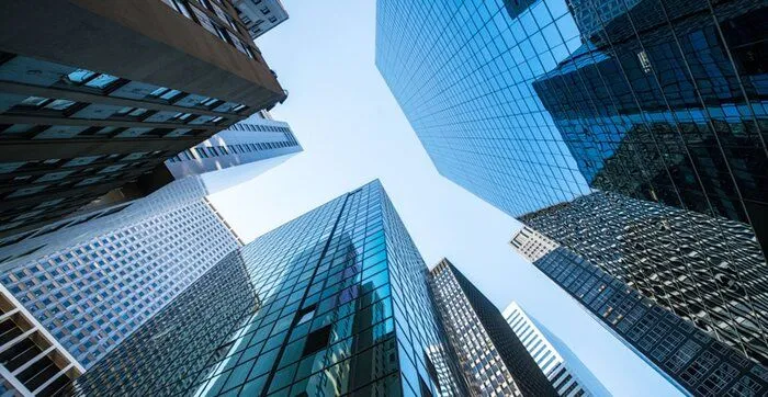 This may contain: looking up at skyscrapers in new york city