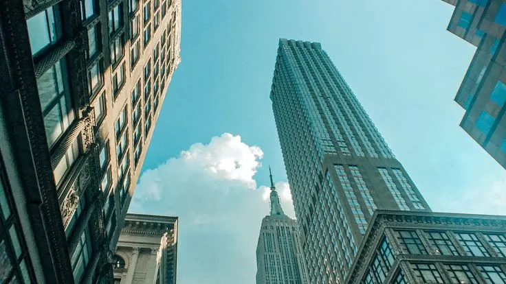 This may contain: looking up at tall buildings in the city