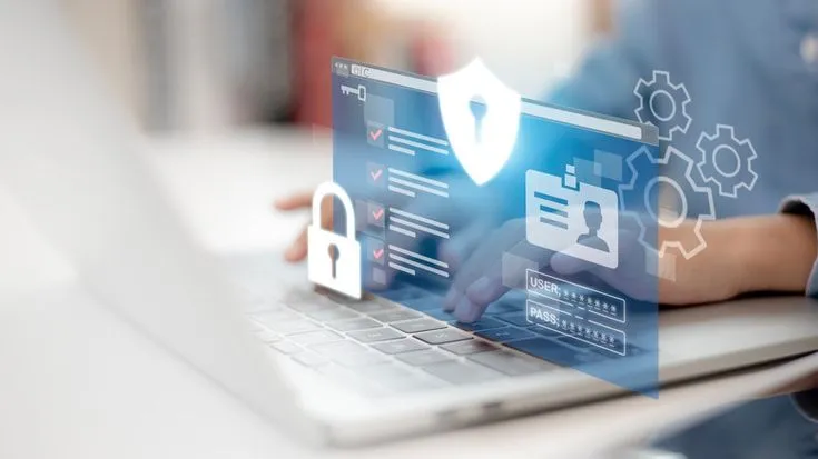 This may contain: a person using a laptop with icons coming out of the screen and padlocks