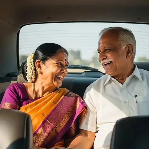 This may contain: an older couple sitting in the back seat of a car smiling at eachother