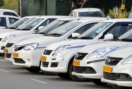 This may contain: a row of white cars parked next to each other