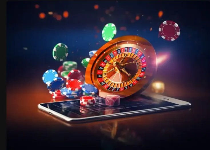 This may contain: a casino machine sitting on top of a cell phone next to chips and dices