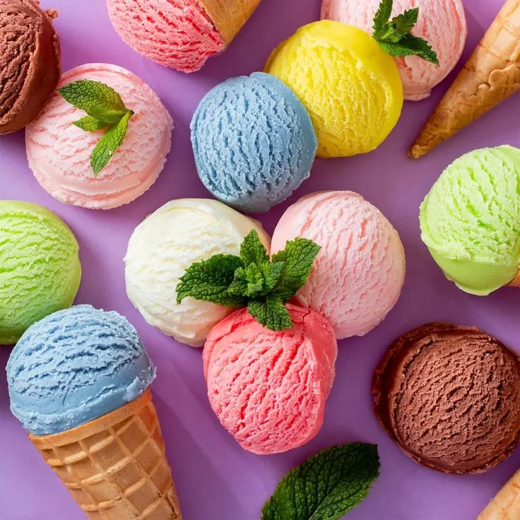 This may contain: colorful ice cream cones with mint sprigs and leaves on purple background, top view