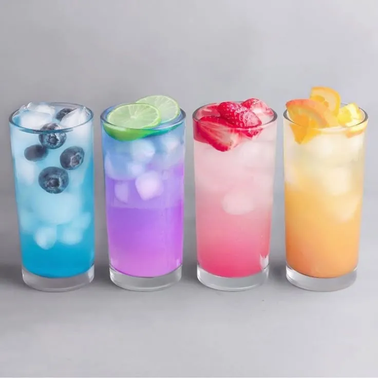 This may contain: four different types of drinks are lined up
