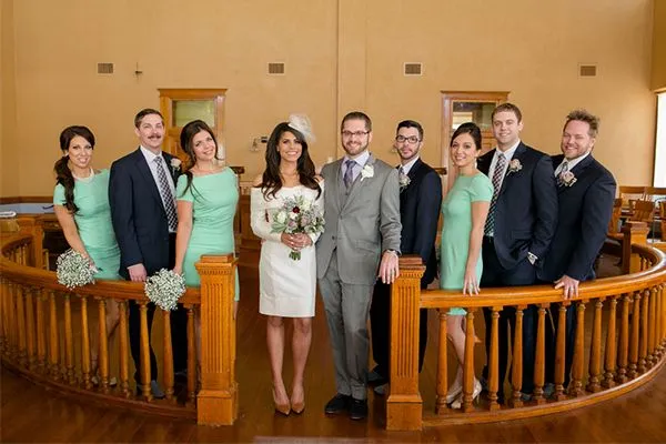 This may contain: a group of people standing on top of a wooden staircase