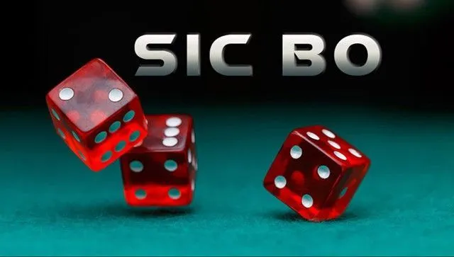 This may contain: two red dices on a green surface with the words sic bo in front of them