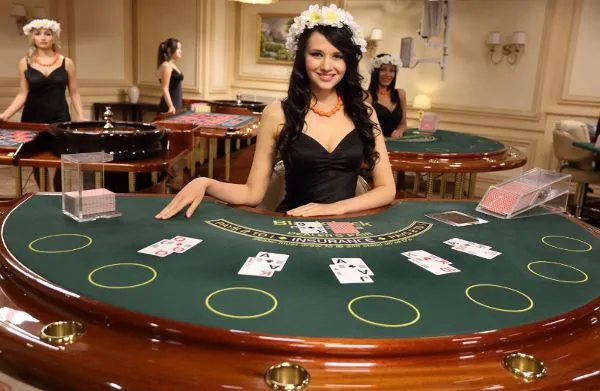 This may contain: a woman standing in front of a blackjack table with cards on it and four other women behind her