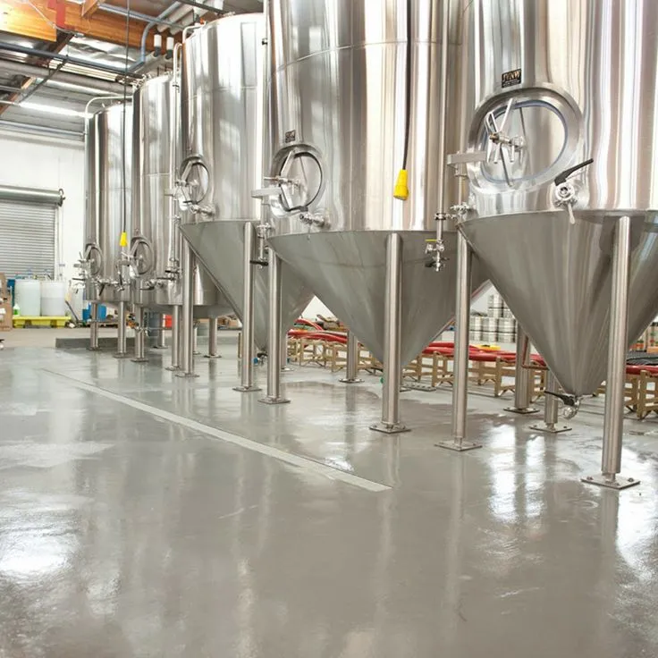 This may contain: a large room filled with lots of metal tanks