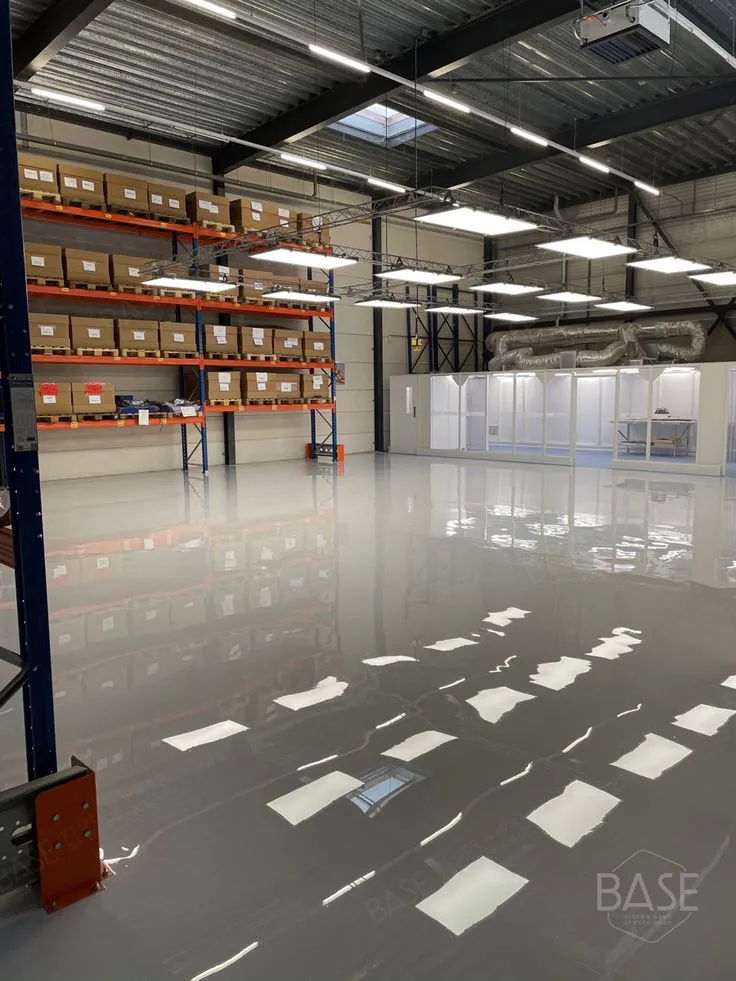 This may contain: an empty warehouse with lots of shelves and boxes