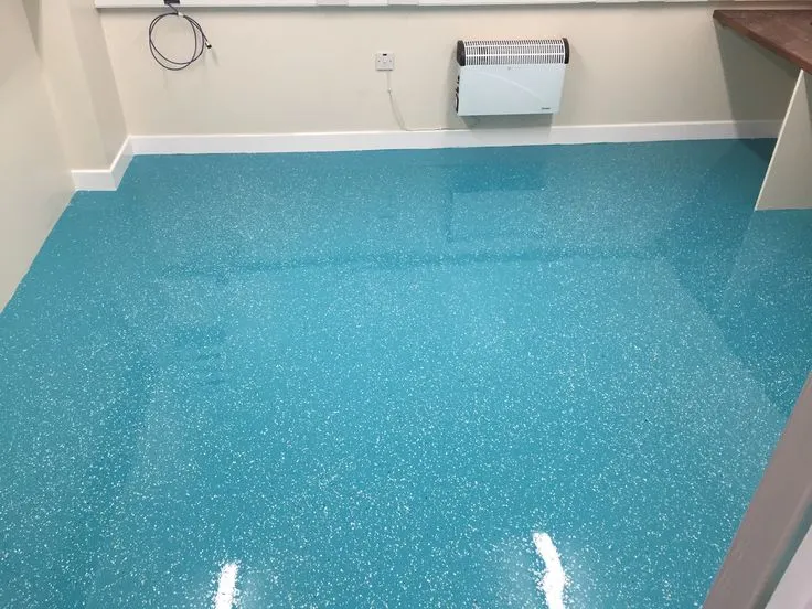 This may contain: a bathroom with blue floors and white walls