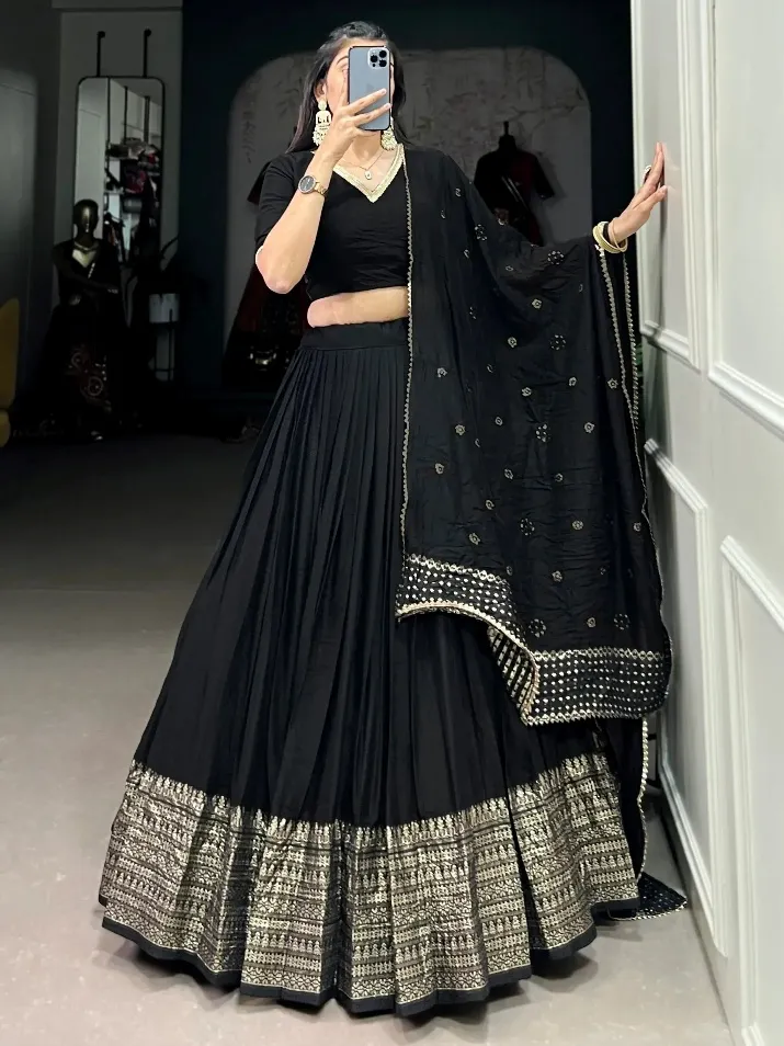 Black lehenga choli with gold embroidery and pleated skirt, ethnic Indian wear for women