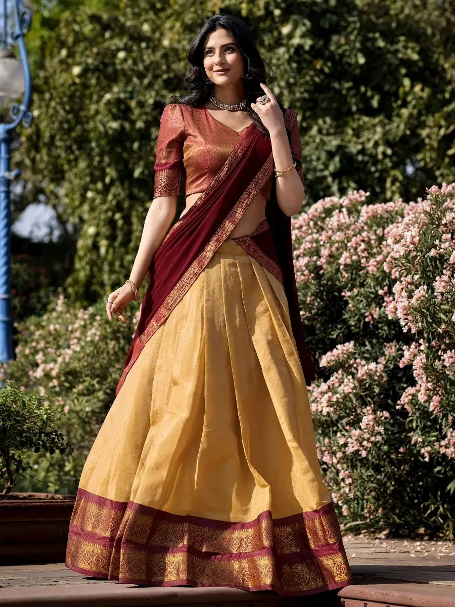 Maroon and gold designer lehenga choli with intricate border, perfect for Indian ethnic wear occasions