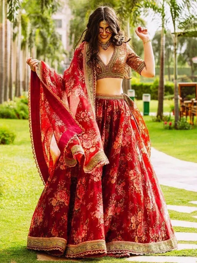 Red floral lehenga choli with gold embroidery, perfect for Indian weddings and festive occasions