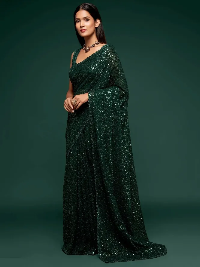 Emerald green sequin saree with V-neck blouse, perfect for Indian ethnic occasions and festive events.