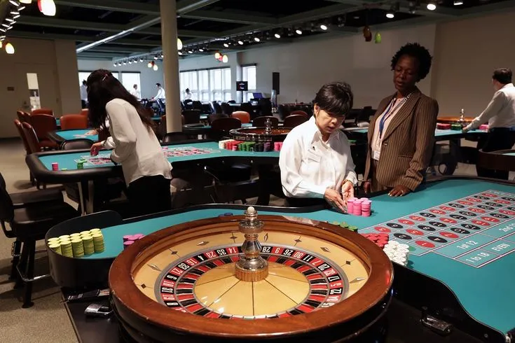 This may contain: people playing roulejack in an office setting