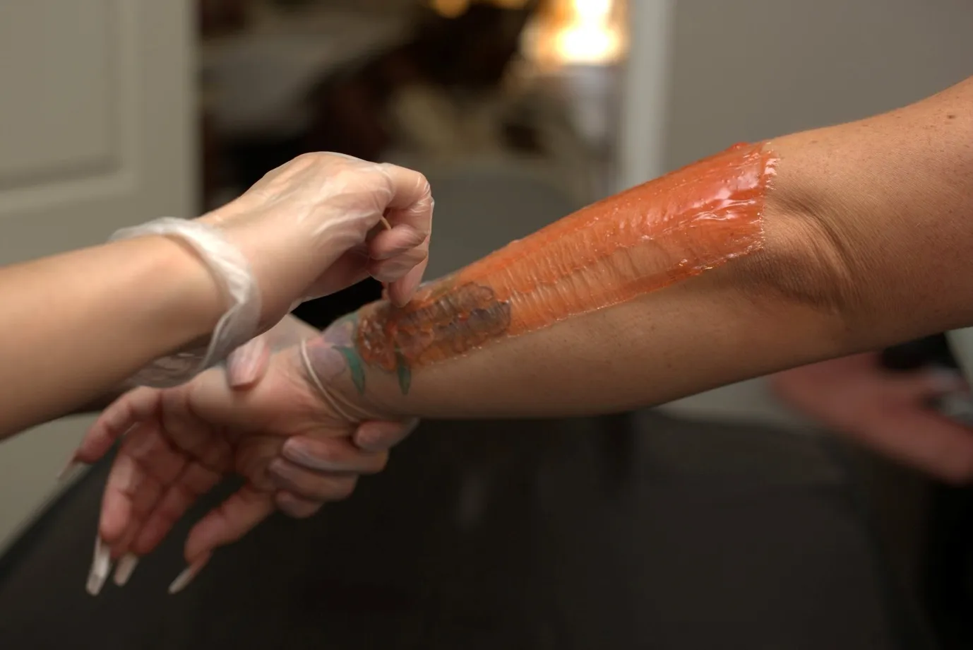 Arm being waxed