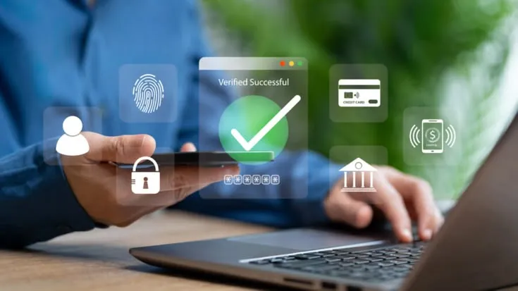 This may contain: a person using a laptop computer with icons coming out of the screen and fingerprints