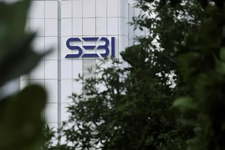 This may contain: a building with the s3i logo on it is seen through some trees and bushes