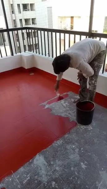 This may contain: a man is painting the floor with red paint
