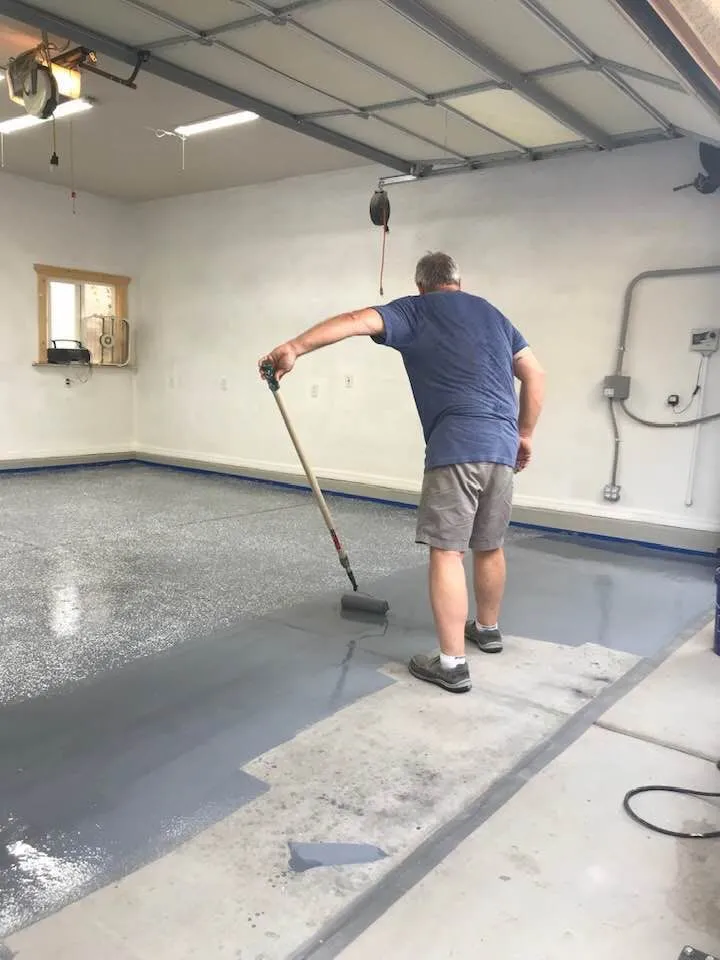 This may contain: a man with a mop is cleaning the floor