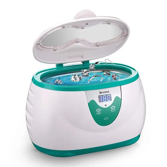 Green Ukoke UUC06G ultrasonic jewelry cleaner with jewelry in tank