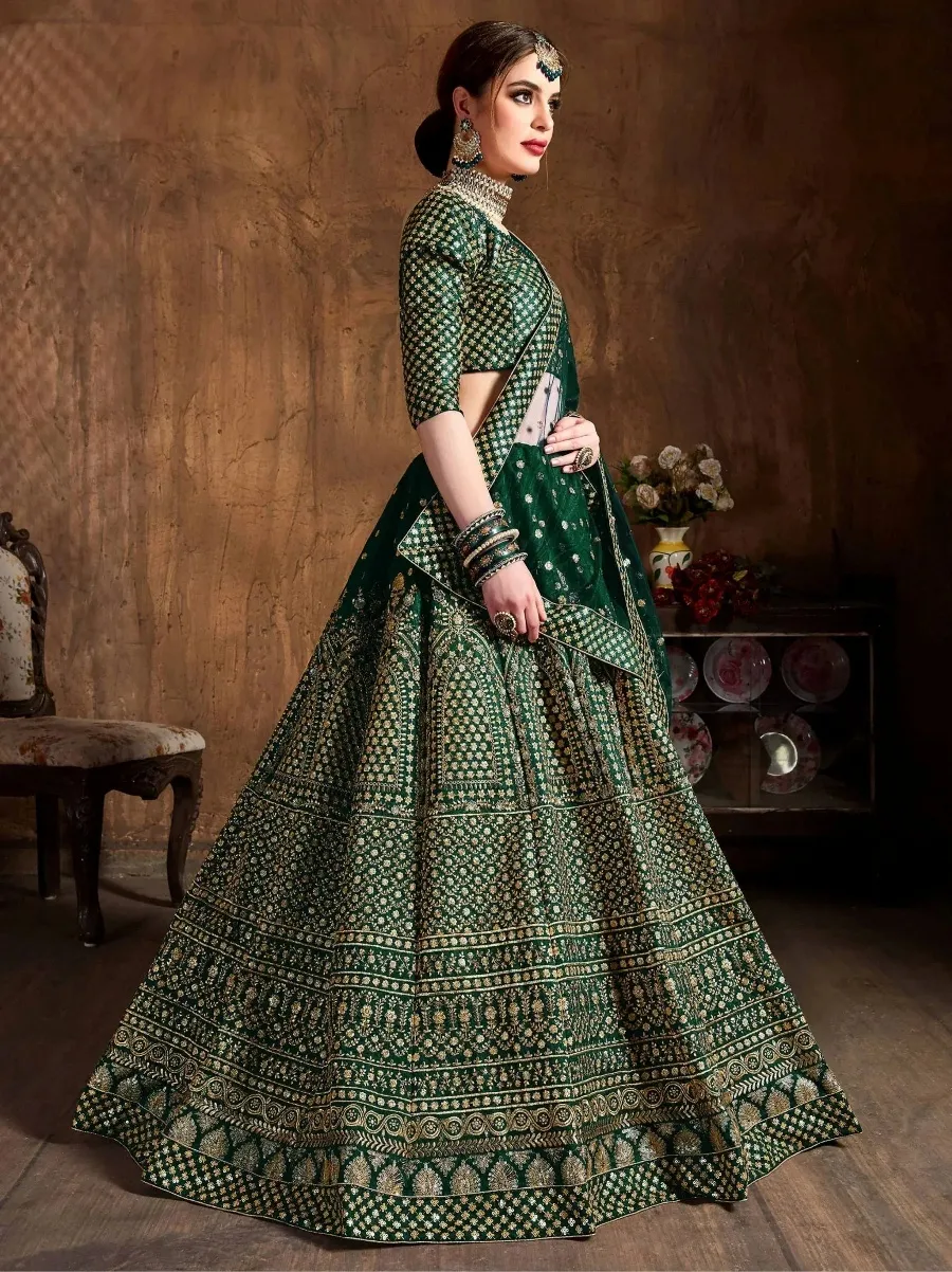 Emerald green designer lehenga choli with gold embroidery, perfect for Indian weddings and festive occasions