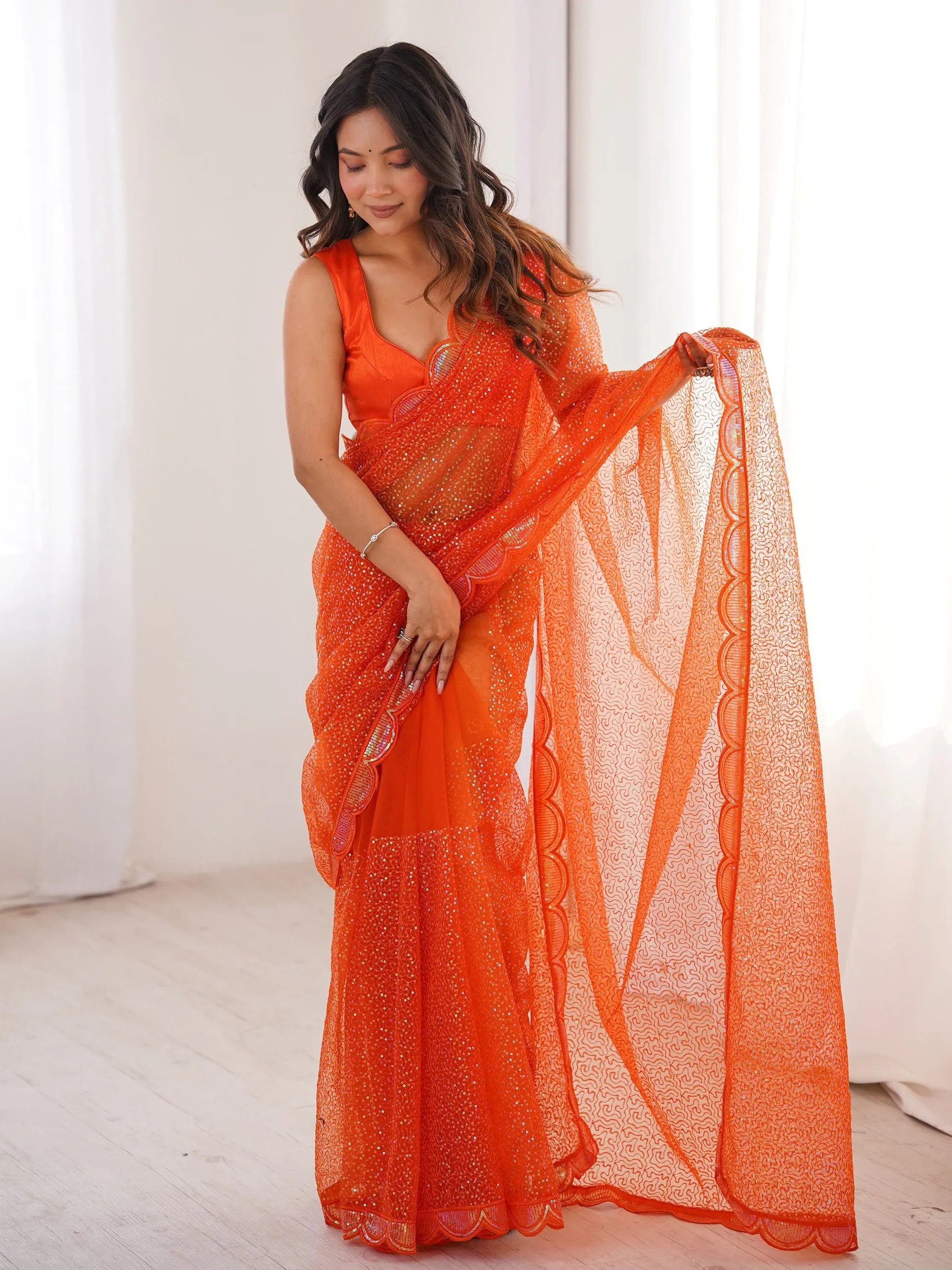 Fabulous Orange Sequins Work Net Party Wear Saree
