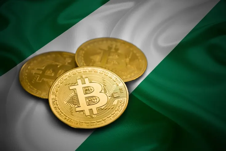 This may contain: three gold bitcoins sitting on top of a green, white and black flag