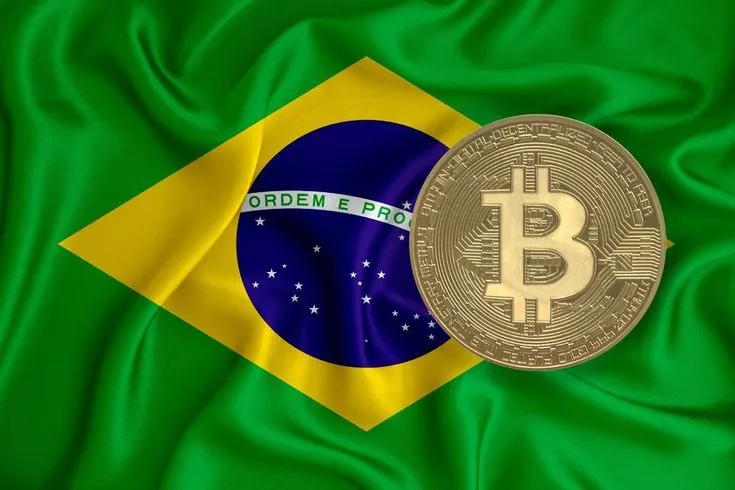 This may contain: a gold bitcoin sitting on top of a green satin with the flag of brazil in the background